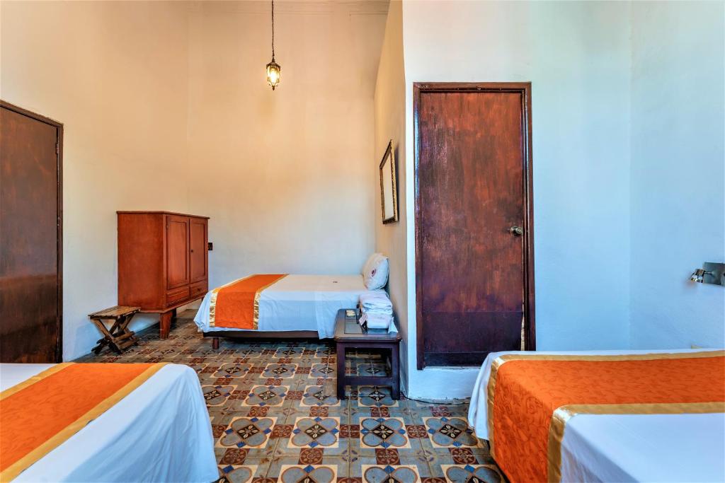 Postel nebo postele na pokoji v ubytování Hotel Gran Centenario