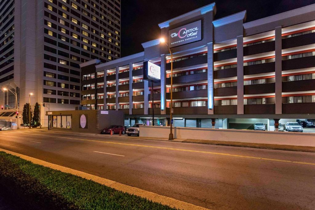 an empty street in front of a building at night at The Capitol Hotel Downtown, Ascend Hotel Collection in Nashville