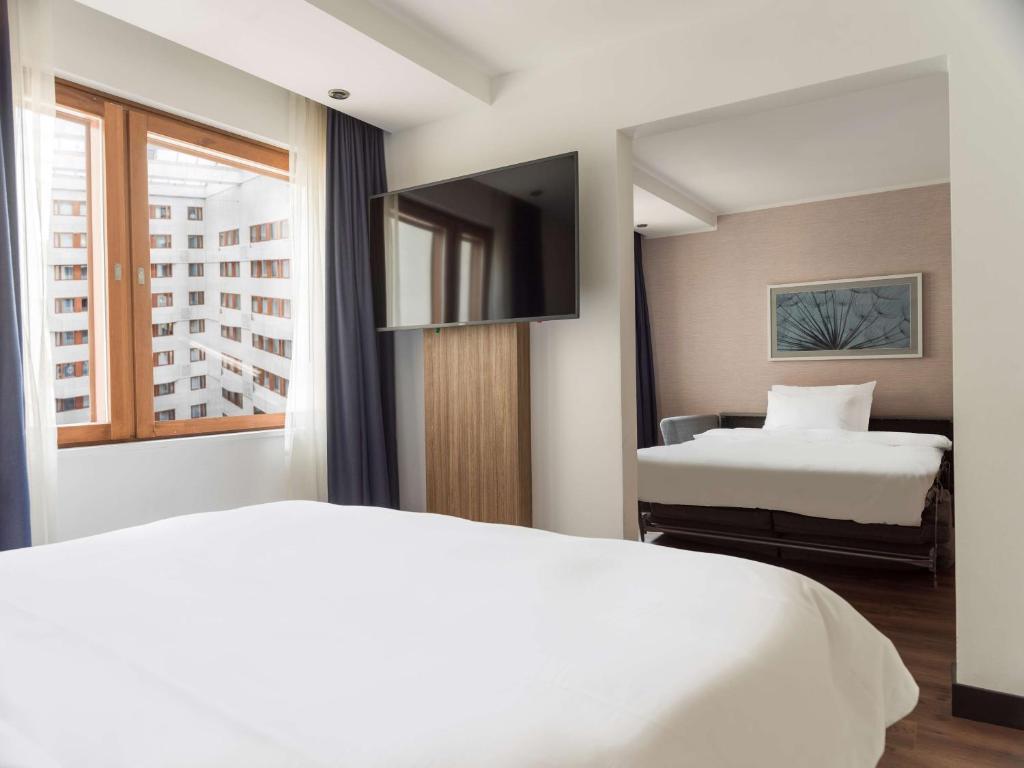Postel nebo postele na pokoji v ubytování Radisson Blu Royal Viking Hotel, Stockholm