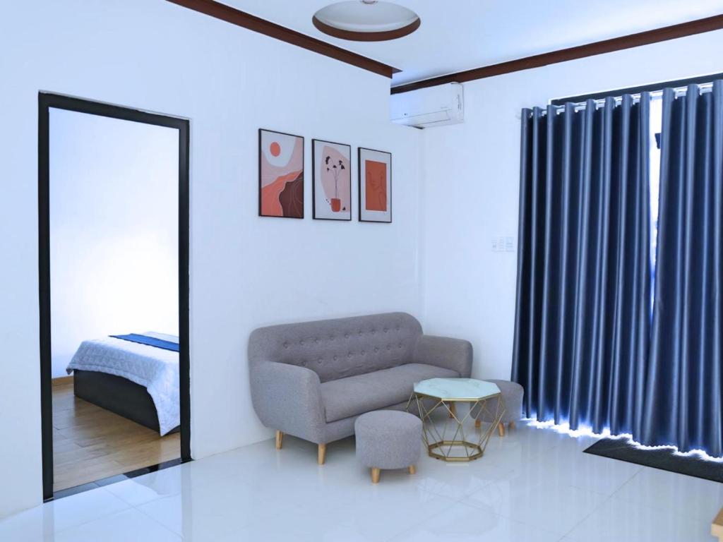Postel nebo postele na pokoji v ubytování QV Manor Homestay