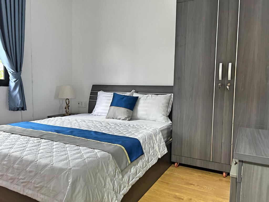 Postel nebo postele na pokoji v ubytování QV Manor Homestay