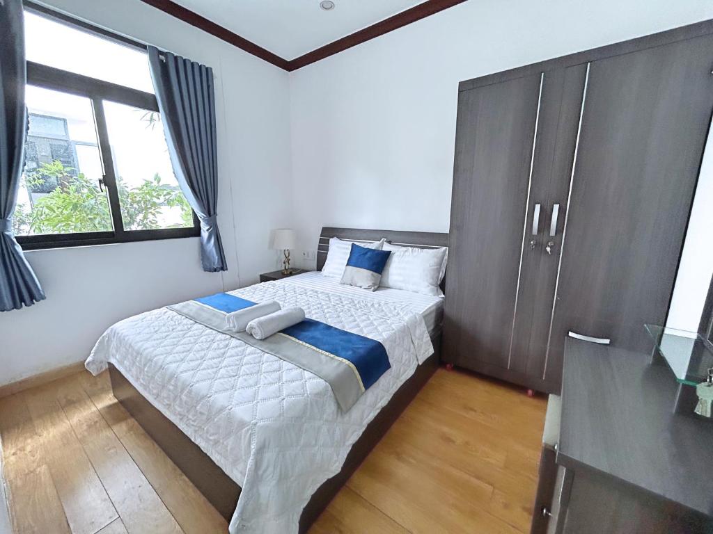 Postel nebo postele na pokoji v ubytování QV Manor Homestay