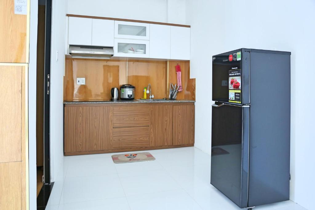 Kuchyň nebo kuchyňský kout v ubytování QV Manor Homestay
