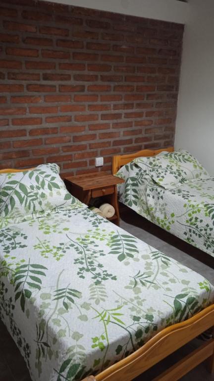 Postel nebo postele na pokoji v ubytování Cabaña Rayen
