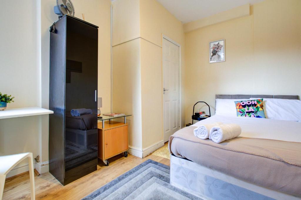 Postel nebo postele na pokoji v ubytování OAT Homes