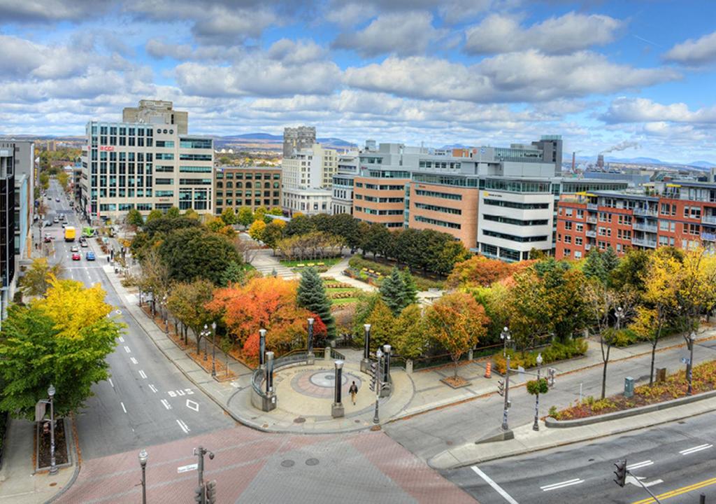 an aerial view of a city with trees and buildings at Condo in St-Roch Downtown Quebec City in Quebec City