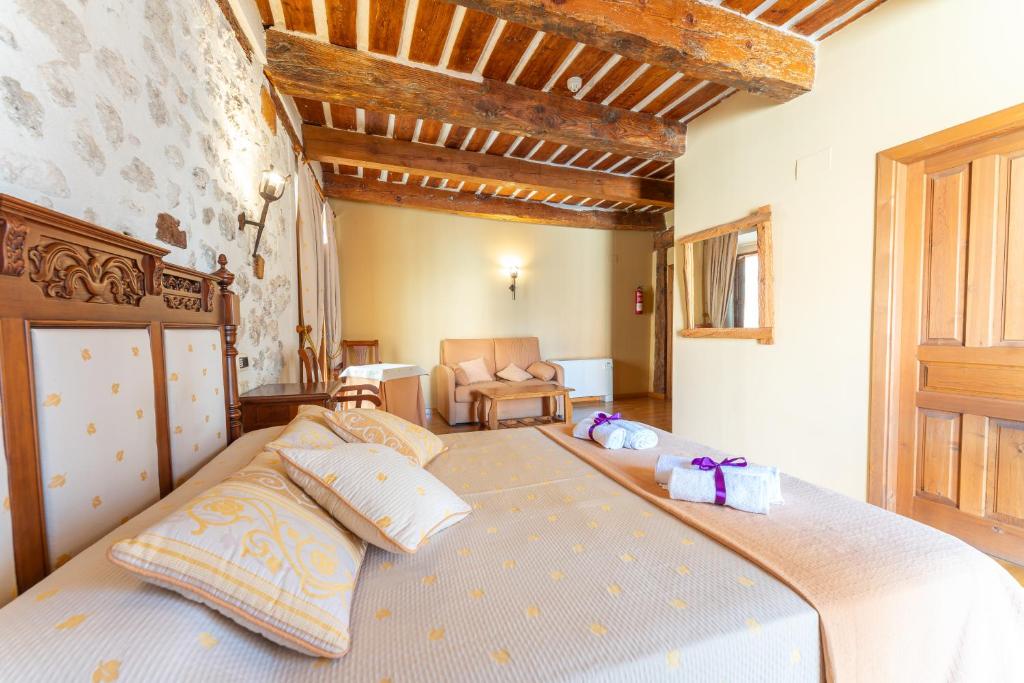 Postel nebo postele na pokoji v ubytování Hotel Rincón Castellano