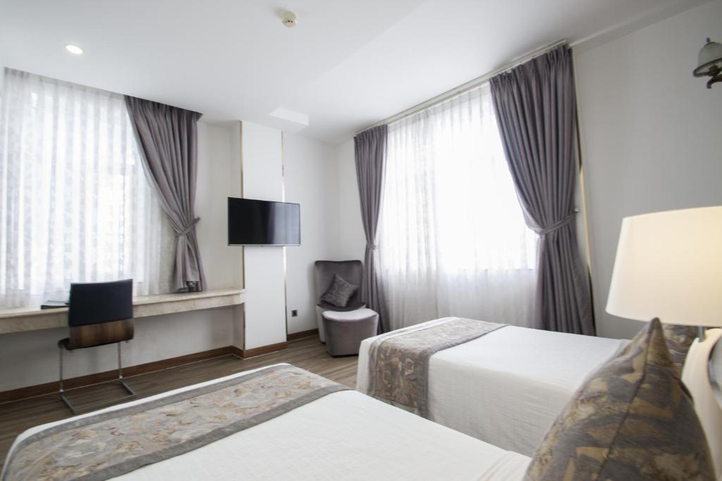 Acnos Grand Hotel - Tweepersoonskamer Met 2 Aparte Bedden