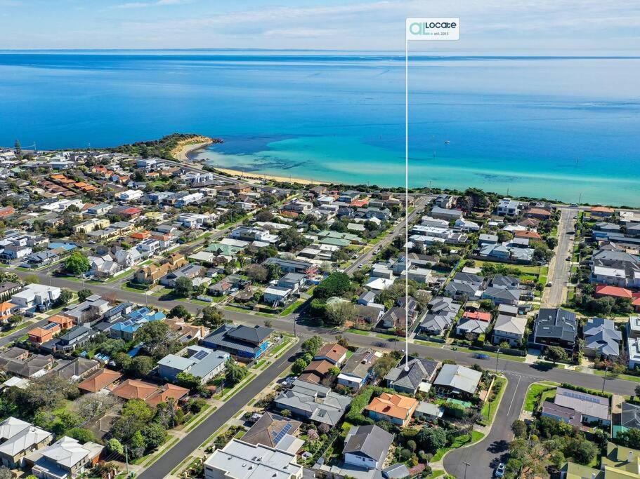 an aerial view of a suburb next to the ocean at Picture-Perfect Mornington Getaway in Mornington