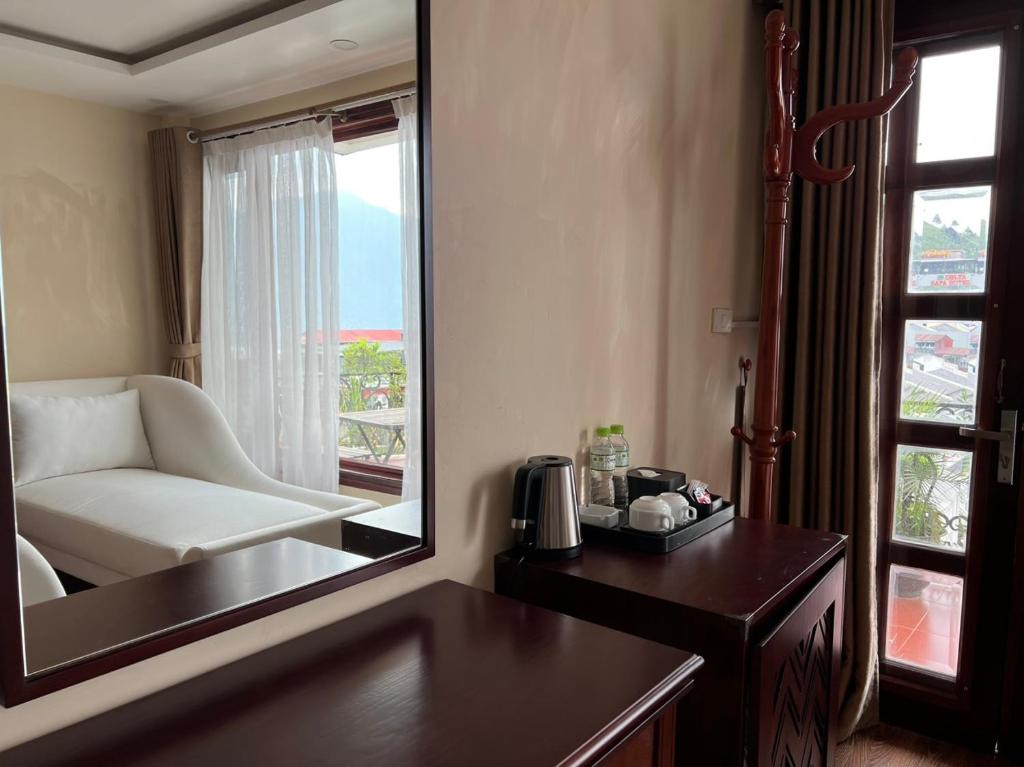 Giường trong phòng chung tại Sapa Centre Hotel