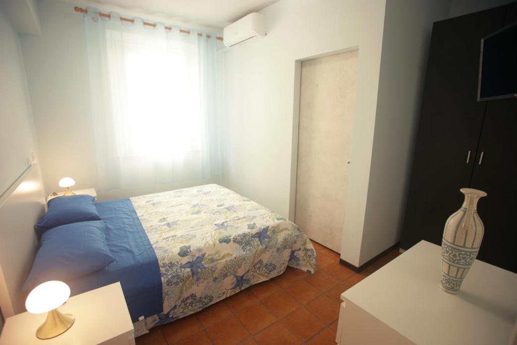 Postel nebo postele na pokoji v ubytování b&b al mare