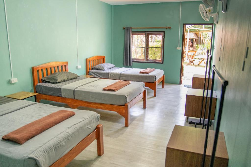Postel nebo postele na pokoji v ubytování Butterfly Hostel, Pai