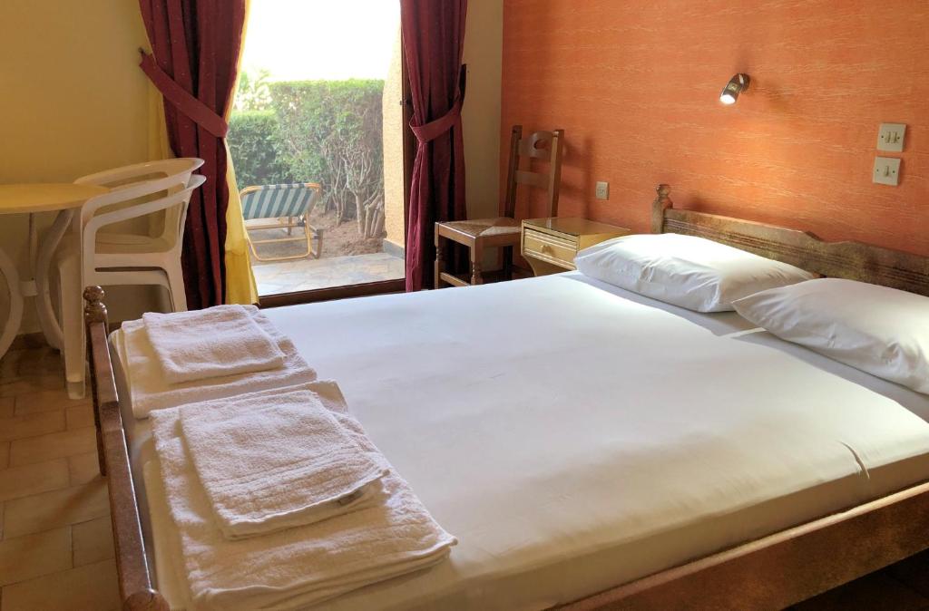 Postel nebo postele na pokoji v ubytování Lappa Hotel