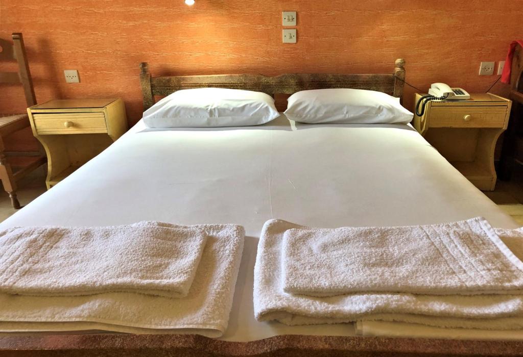 Postel nebo postele na pokoji v ubytování Lappa Hotel