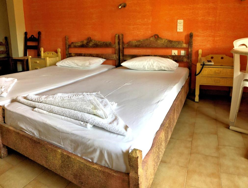 Postel nebo postele na pokoji v ubytování Lappa Hotel