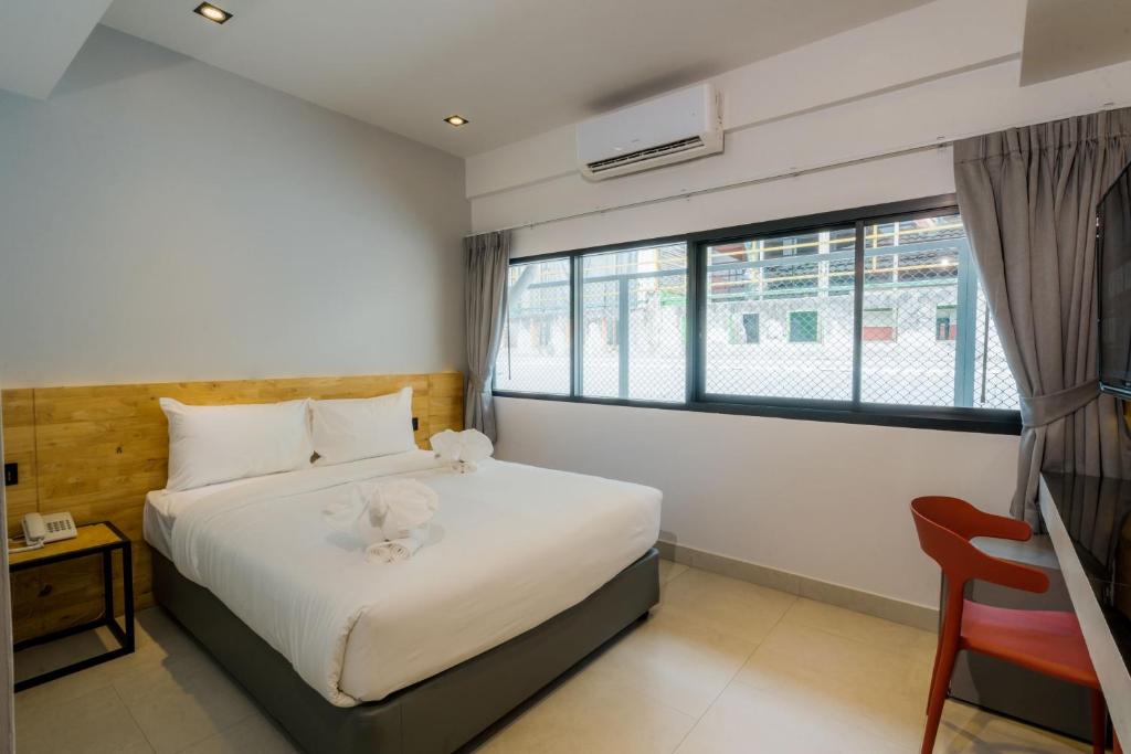 Postel nebo postele na pokoji v ubytování Lek Lek Samui Room X Coffee Bar