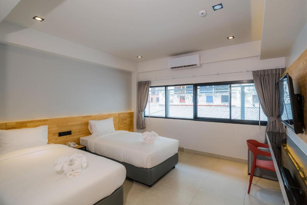 Postel nebo postele na pokoji v ubytování Lek Lek Samui Room X Coffee Bar