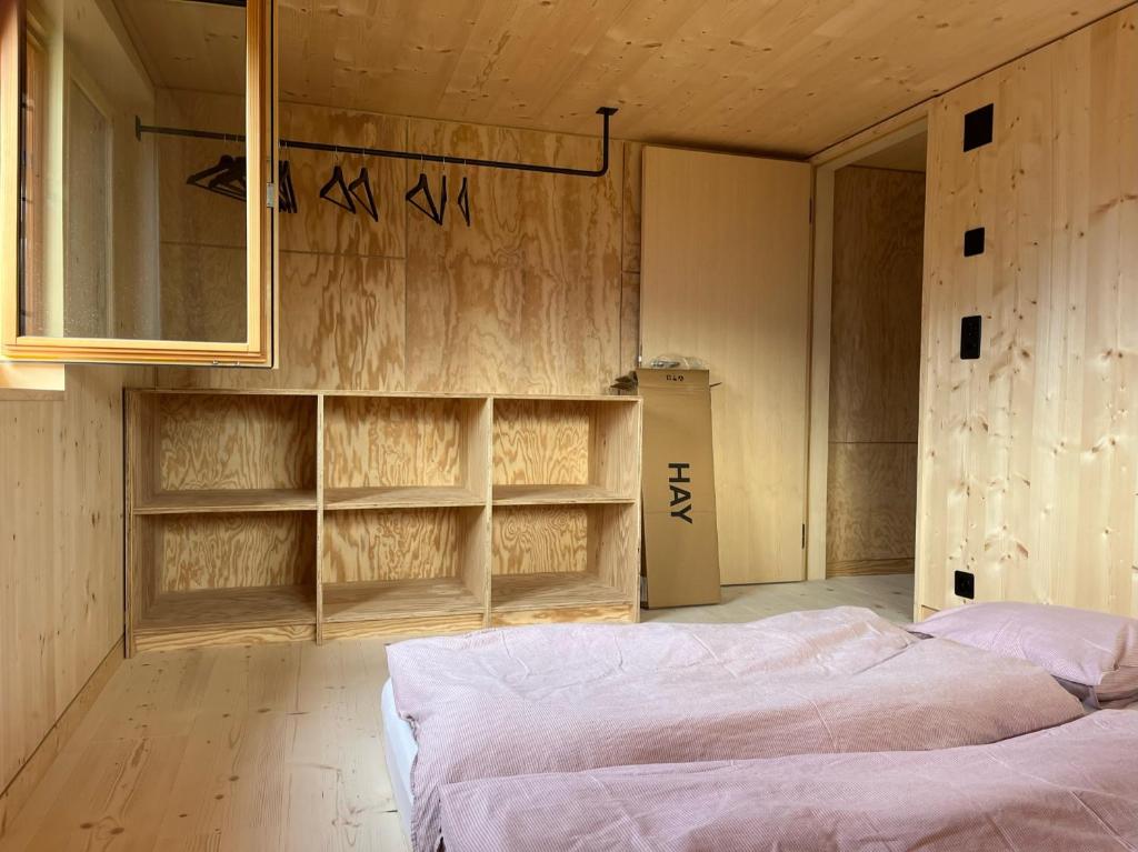 Postel nebo postele na pokoji v ubytování Sunnehuesli
