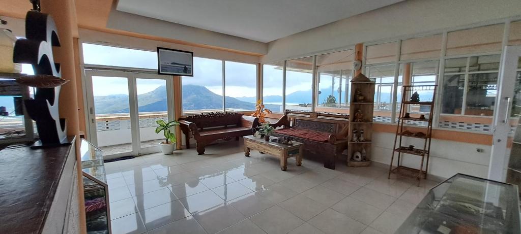 a living room with a view of the mountains at The Kayuan in Kintamani