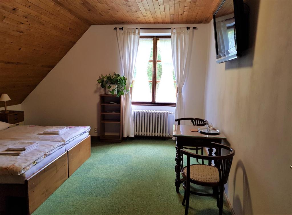 Postel nebo postele na pokoji v ubytování Chalupa pod strání
