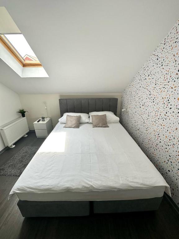Postel nebo postele na pokoji v ubytování KAPTOL Rooms