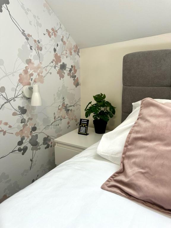 Postel nebo postele na pokoji v ubytování KAPTOL Rooms
