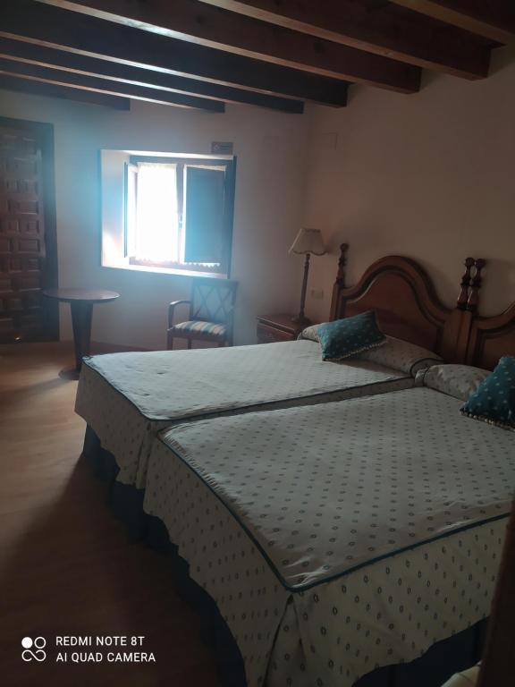 Postel nebo postele na pokoji v ubytování Hotel la posada de Numancia