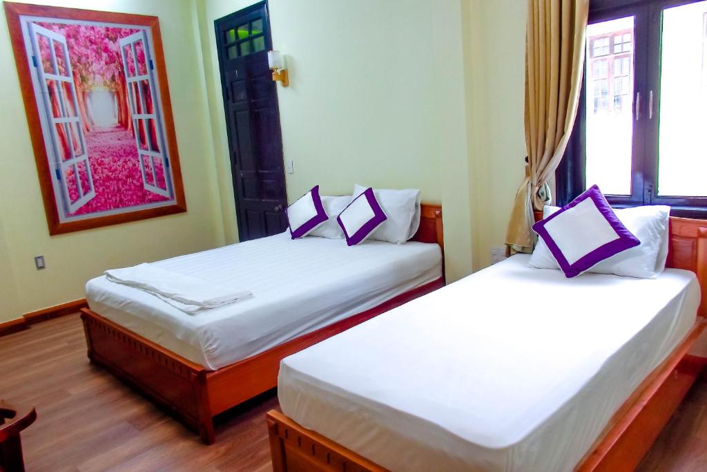 Postel nebo postele na pokoji v ubytování Anh Family Homestay