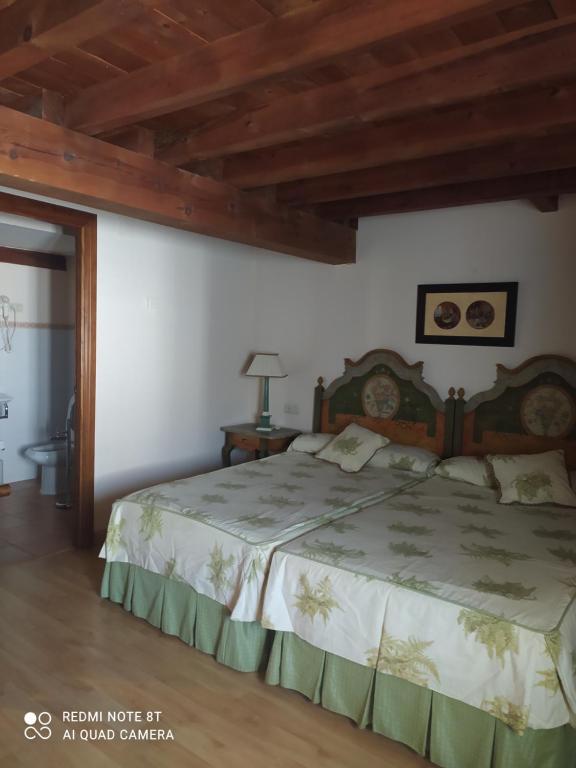 Postel nebo postele na pokoji v ubytování Hotel la posada de Numancia