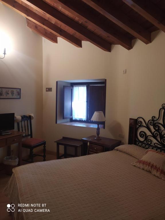 Postel nebo postele na pokoji v ubytování Hotel la posada de Numancia