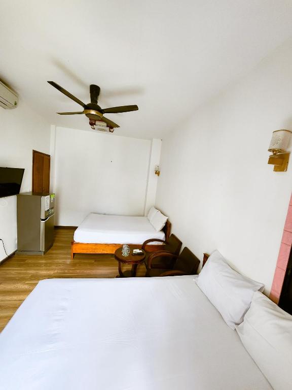 Postel nebo postele na pokoji v ubytování Anh Family Homestay