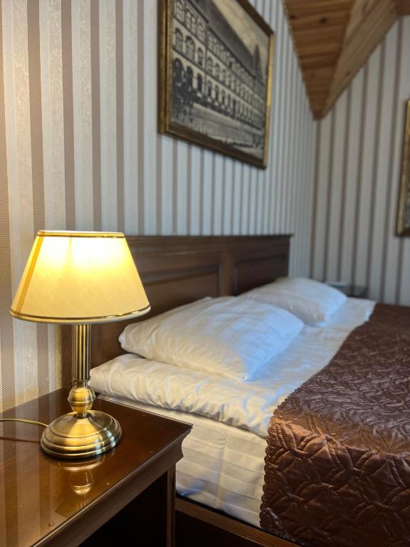 Postel nebo postele na pokoji v ubytování Guest House Villa Lamperti