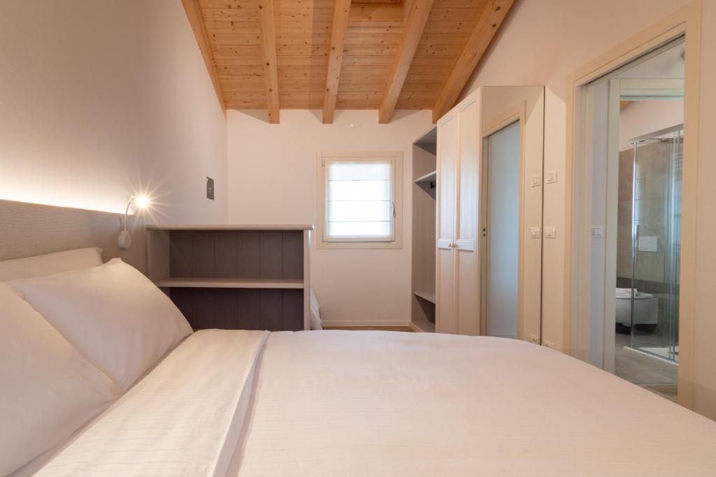 Postel nebo postele na pokoji v ubytování BORGO STALIS RESORT