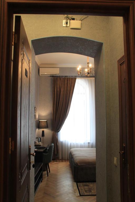 Postel nebo postele na pokoji v ubytování Hotel 1883