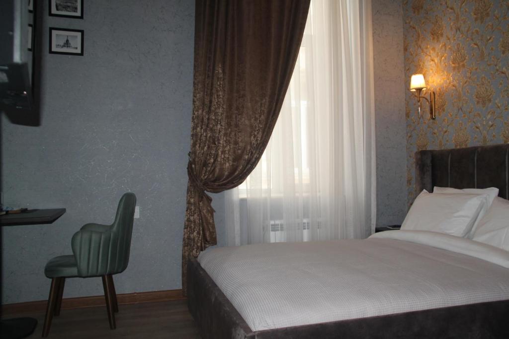 Postel nebo postele na pokoji v ubytování Hotel 1883