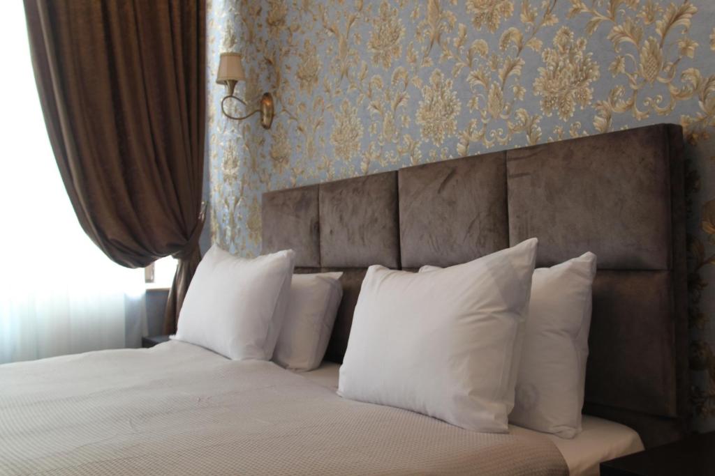 Postel nebo postele na pokoji v ubytování Hotel 1883