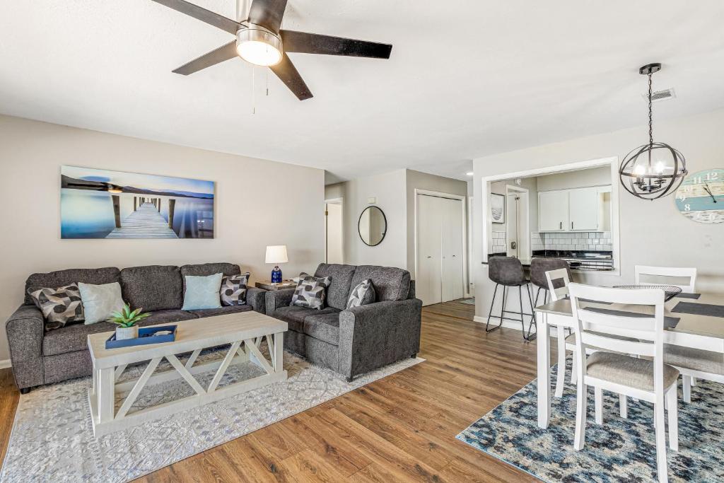 a living room with a couch and a table at Lake Escape in Hot Springs