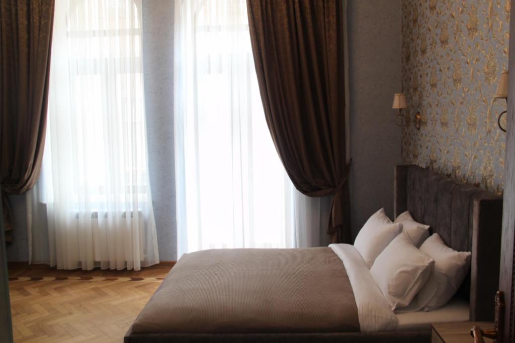 Postel nebo postele na pokoji v ubytování Hotel 1883