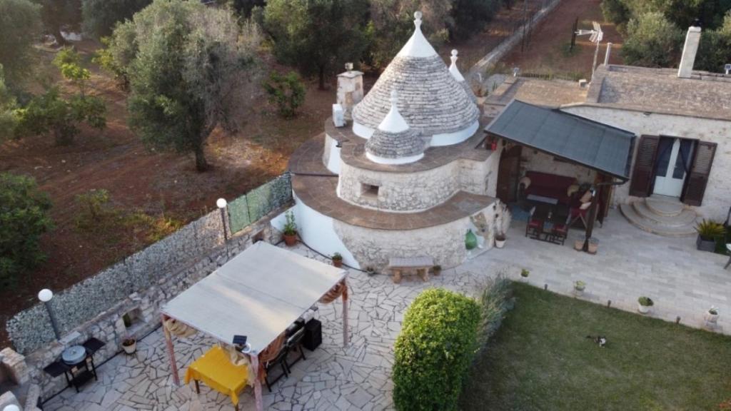 an aerial view of a building with a roof at Trullo Tranquillo in San Michele Salentino