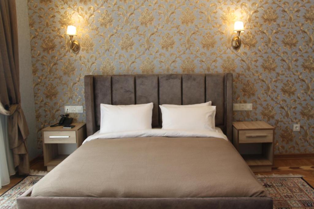Postel nebo postele na pokoji v ubytování Hotel 1883