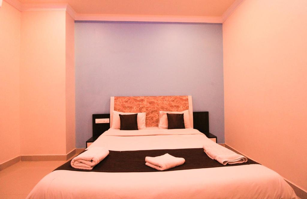 Postel nebo postele na pokoji v ubytování Bouvana Residency