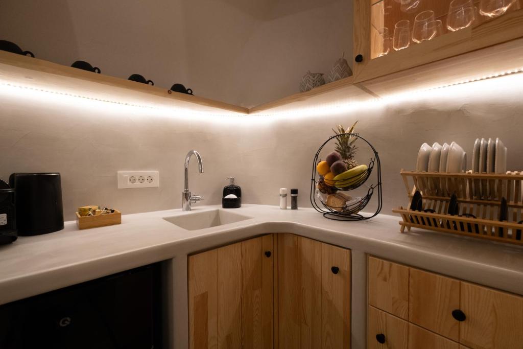 Kuchyň nebo kuchyňský kout v ubytování CABO ESTE SUITES