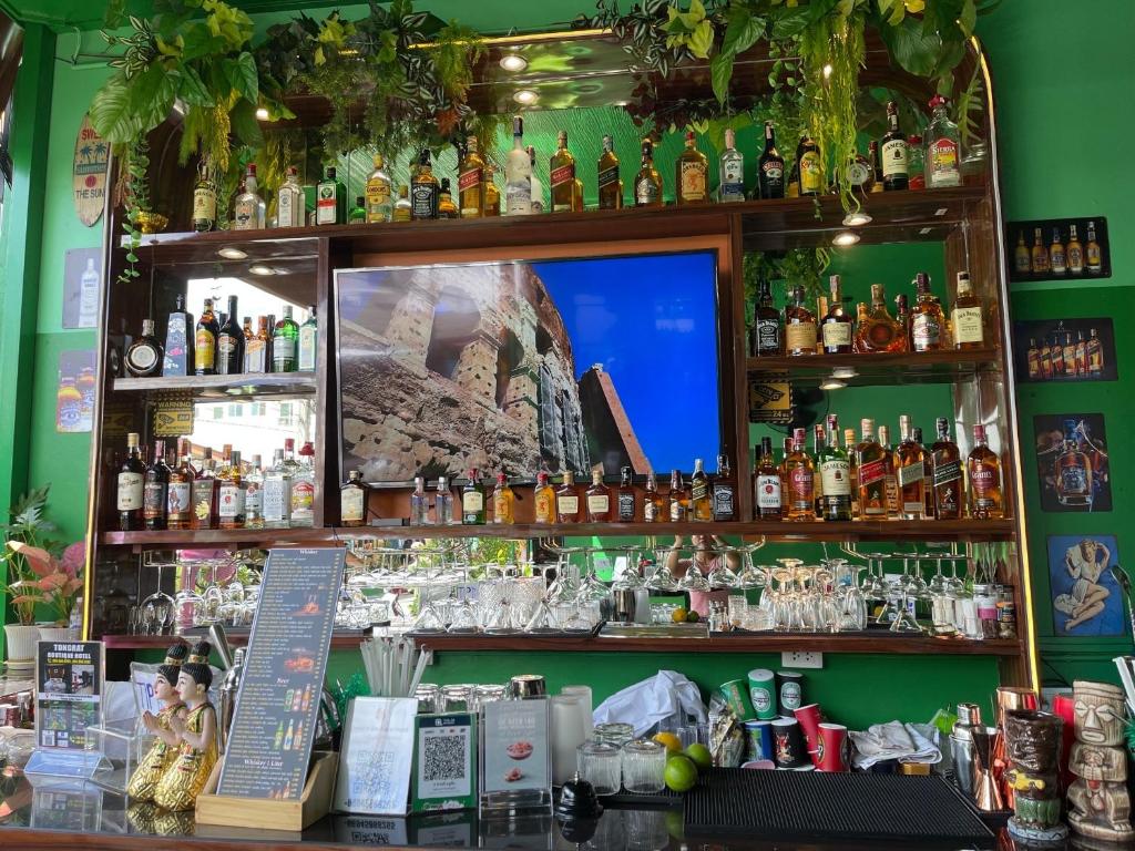 a bar filled with lots of bottles of alcohol at Elephant Room in Patong Beach