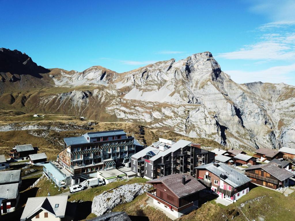 an aerial view of a town in front of a mountain at Frutt Living in Kerns