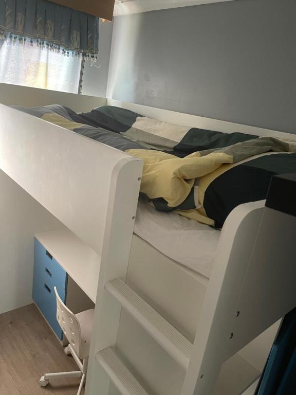 a bedroom with a bunk bed and a desk at Walpole House 2 in London