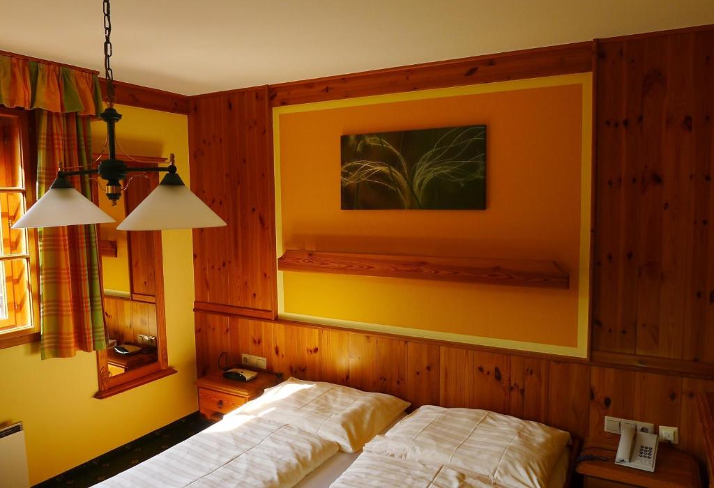 Posteľ alebo postele v izbe v ubytovaní Hotel garni Weinberghof & Weingut Lagler