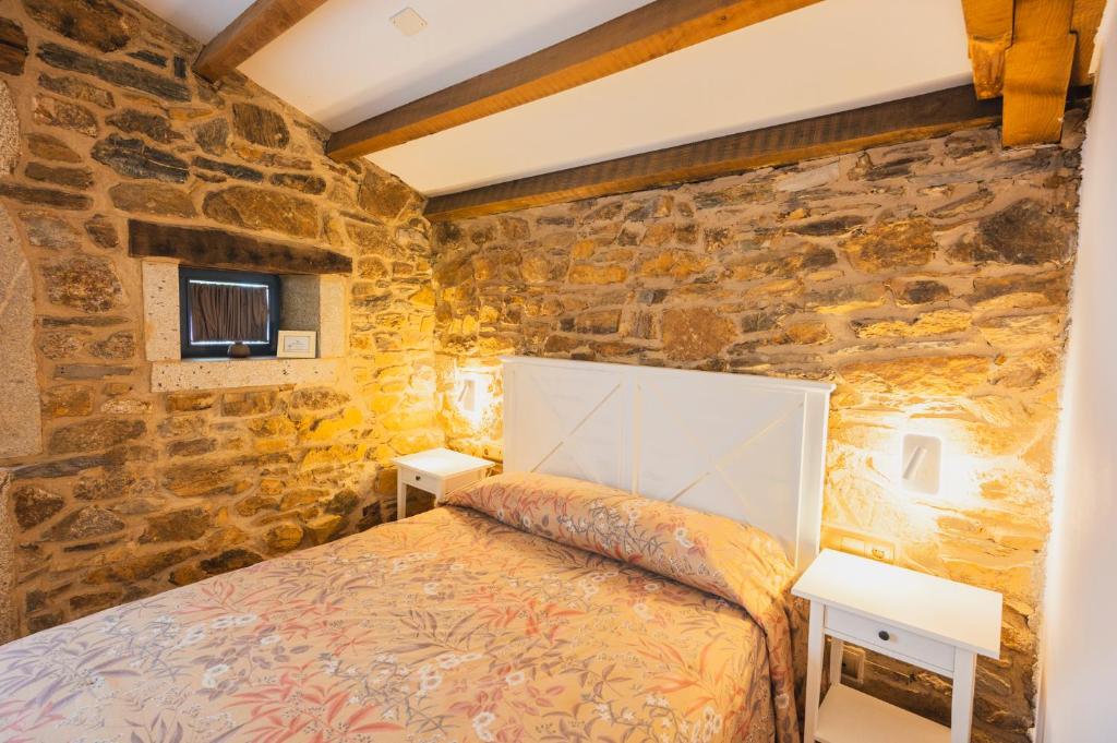 Postel nebo postele na pokoji v ubytování Casa de Amancio