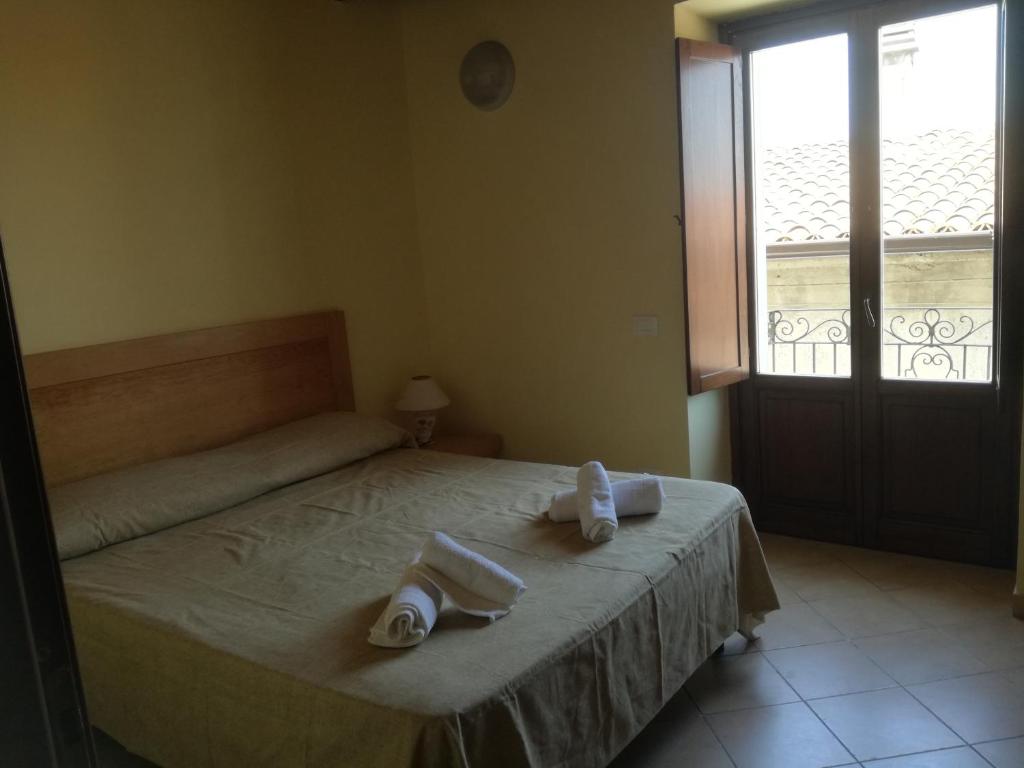 Postel nebo postele na pokoji v ubytování Albergo Diffuso IL MIGLIO
