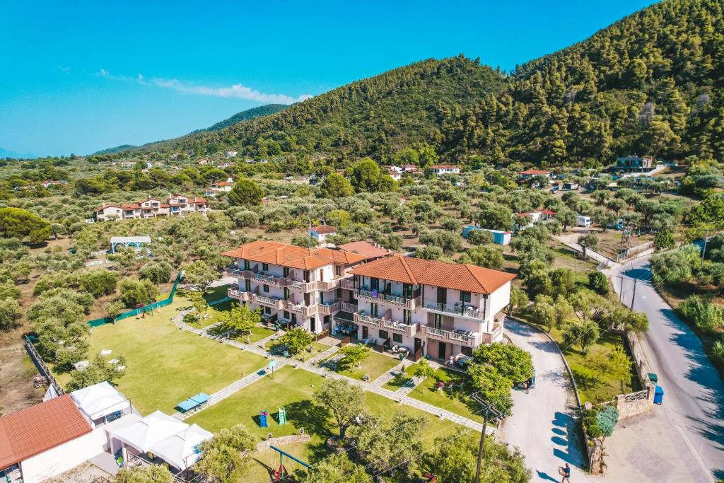 an aerial view of an apartment building with a park at Aroma Studios and Apartments in Vourvourou