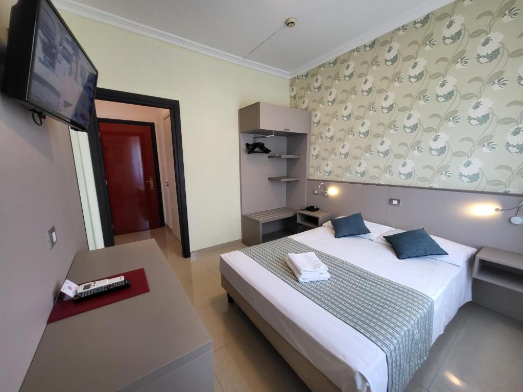Rúm í herbergi á Hotel Dei Fiori